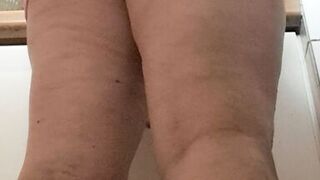 in the kitchen half-dressed