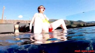 Red XXX fucks her pussy with a toy in the pool - 14 image