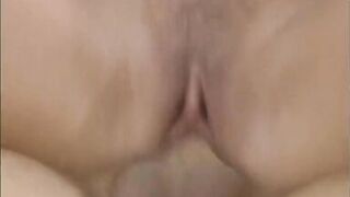 Brunet slut with massive tits rides a long white cock in her