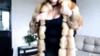 Hot sexy Russian MILF slut in a fur coat and a cigarette...